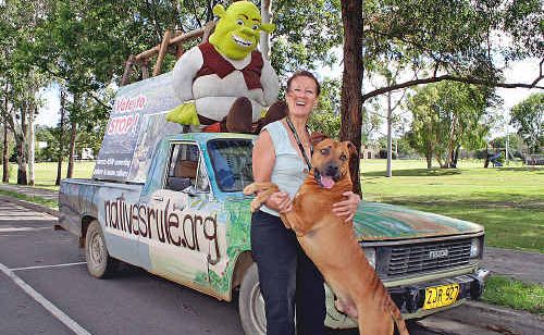 Frances Pike with The Golden Pup (aka her dog Buster) and her ute. Frances Pike with The Golden Pup (aka her dog Buster) and her ute.